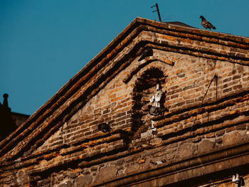 Low angle view of building against clear sky