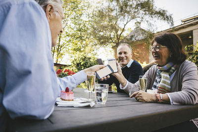 Two people sitting on table