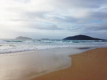 Scenic view of beach against sky