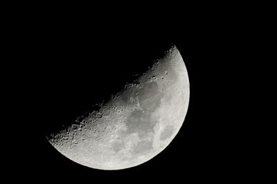 Low angle view of moon in sky at night