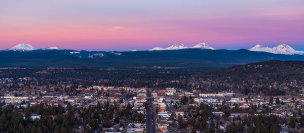 Panoramic shot of townscape against sky during sunset