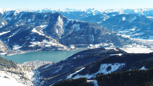 Winter lake near zell am see from mountain summit of sunny austrian alps