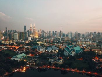 Illuminated city against sky