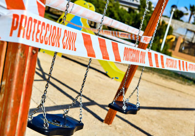 Close-up of swing hanging on rope