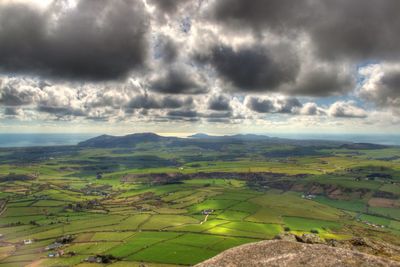 Scenic view of landscape against cloudy sky