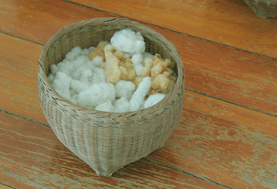 High angle view of eggs in basket on table