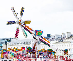 Low angle view of amusement park ride against sky