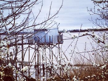 Scenic view of lake against sky during winter