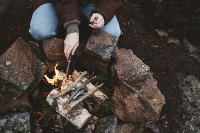 Woman preparing campfire