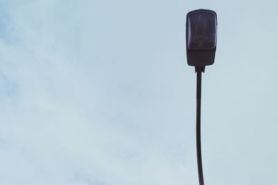 Low angle view of street light against sky
