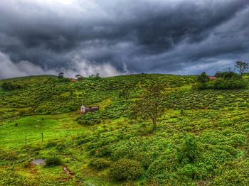 Scenic view of landscape against cloudy sky