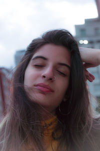 Close-up portrait of a smiling young woman