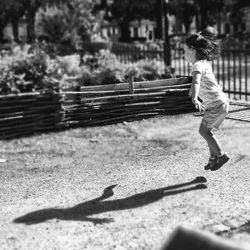 Full length of children on footpath in park