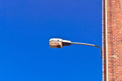 Low angle view of built structure against clear blue sky