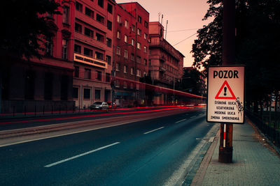 Road sign on street in city