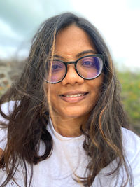 Portrait of smiling young woman outdoors