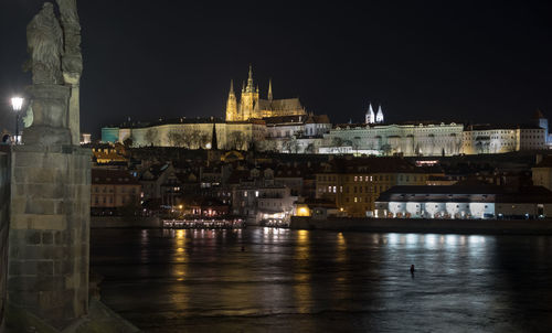 Illuminated buildings at waterfront