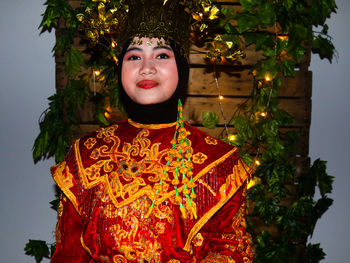 Portrait of woman with christmas tree