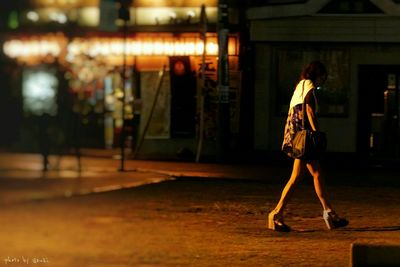 Full length of woman standing at night