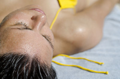 Close-up of young woman lying down