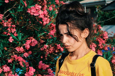 Portrait of woman with red flowers