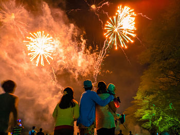 A family watching the fireworks together at munoz, nueva ecija, philippines.