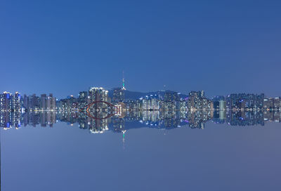 Illuminated buildings in water