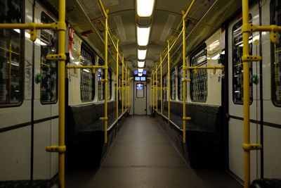 Interior of illuminated train at night