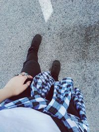 Low section of people standing on road