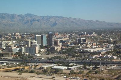 Cityscape with mountain range in background