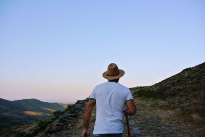 Rear view of man standing on landscape