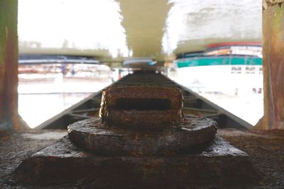 Close-up of water in container against sky