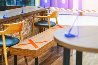 High angle view of empty chairs and table in restaurant