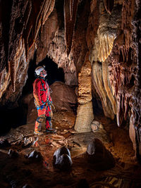 Full length of man standing in cave