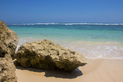 Scenic view of sea against clear blue sky