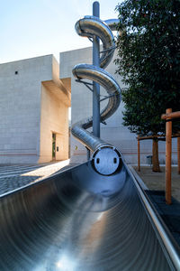 Metal structure in park against clear sky