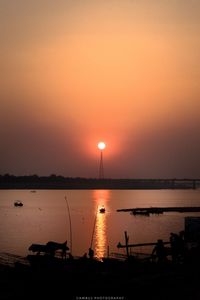 Scenic view of lake against romantic sky at sunset