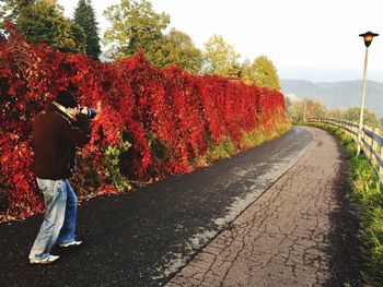 Person photographing on road