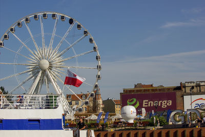 Low angle view of ferris wheel against sky