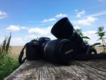 Close-up of camera against sky