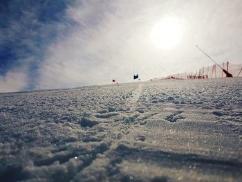 Surface level of land against sky during winter