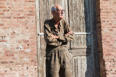 Portrait of senior adult man wearing working clothing