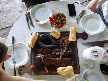 High angle view of woman preparing food on table