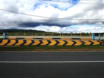 Empty road sign against sky
