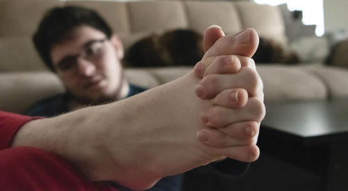 Close-up of young man at home