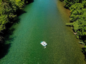 High angle view of boat floating on lake