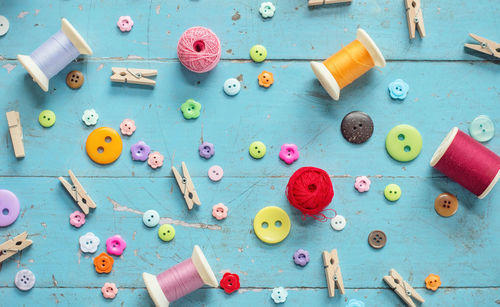 High angle view of multi colored buttons on table