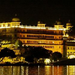 Reflection of illuminated buildings in water at night