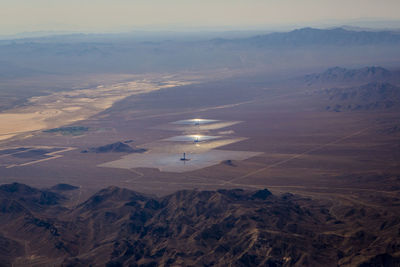 High angle view of center pivot irrigation at desert against sky