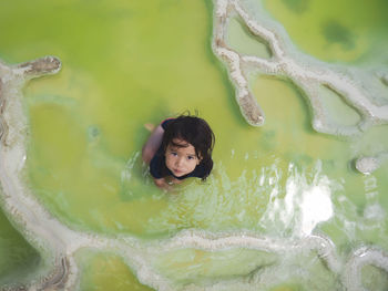 Boy swimming in pool